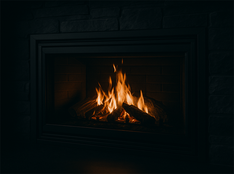 Gas fireplace with glowing flames, maintained by Ambient Heating & Cooling in Nanaimo, BC